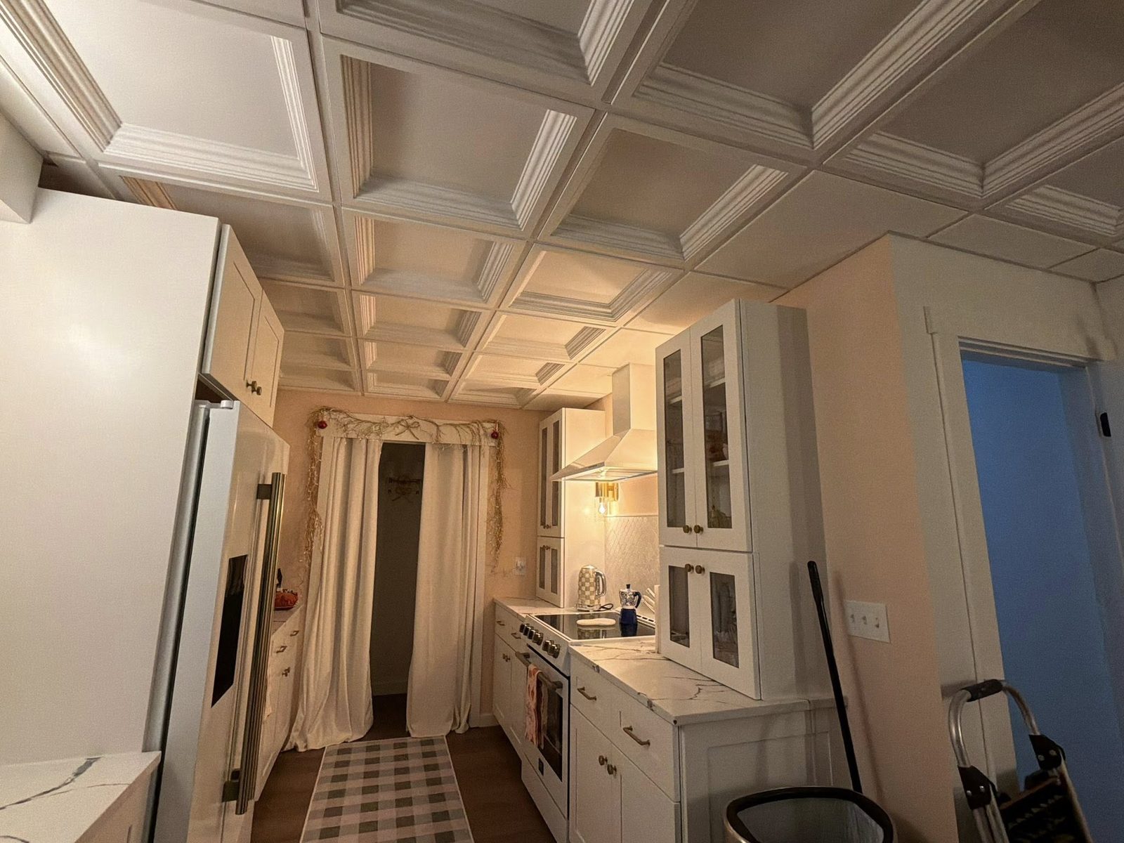 Finished basement kitchen with white coffered ceiling tiles